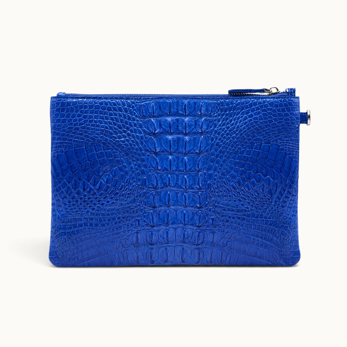 Back view of a royal blue exotic leather wristlet clutch showing natural crocodile scales