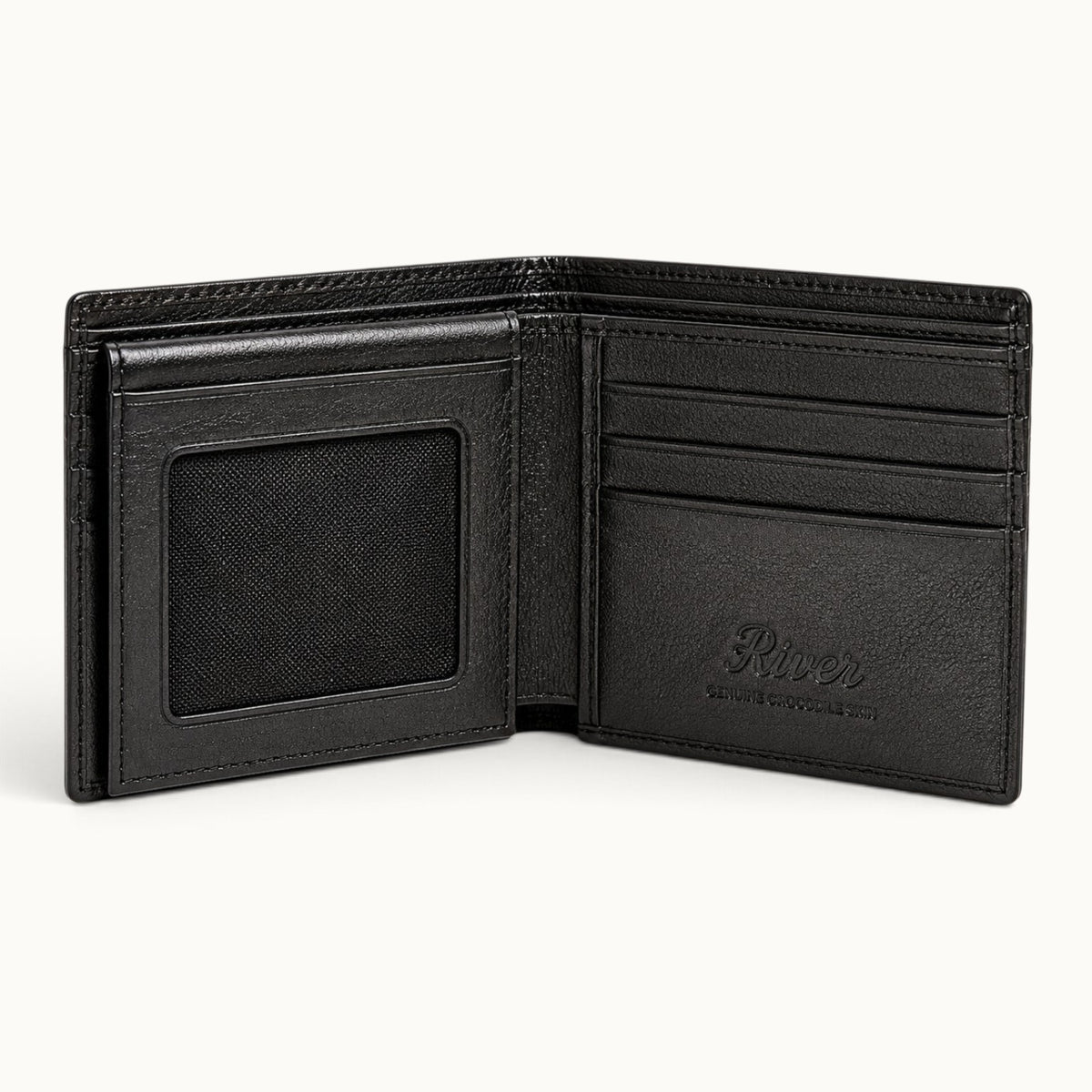 Open interior view of The Ashford luxury crocodile bifold wallet, featuring smooth full-grain calf leather, dual mesh ID windows, six card slots, and an embossed RIVER logo.