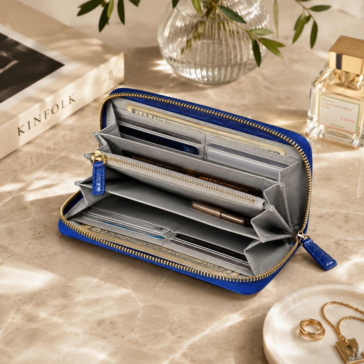 Belvedere Royal Blue Siamese crocodile zip-around wallet open and filled with cards, cash, and everyday essentials to show interior capacity and organization.