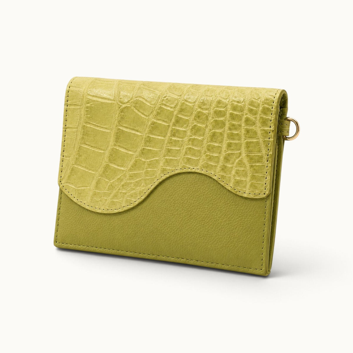 Angle view of The Berkeley Convertible Wallet in Lime Green with genuine Siamese crocodile leather, pebbled calf leather, and gold-tone hardware.