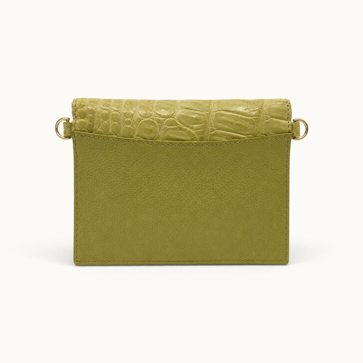 Back view of The Berkeley Crocodile Convertible Wallet in Lime Green with a slim exterior slip pocket, soft pebbled calf leather, genuine Siamese crocodile trim, and gold-tone D-rings.