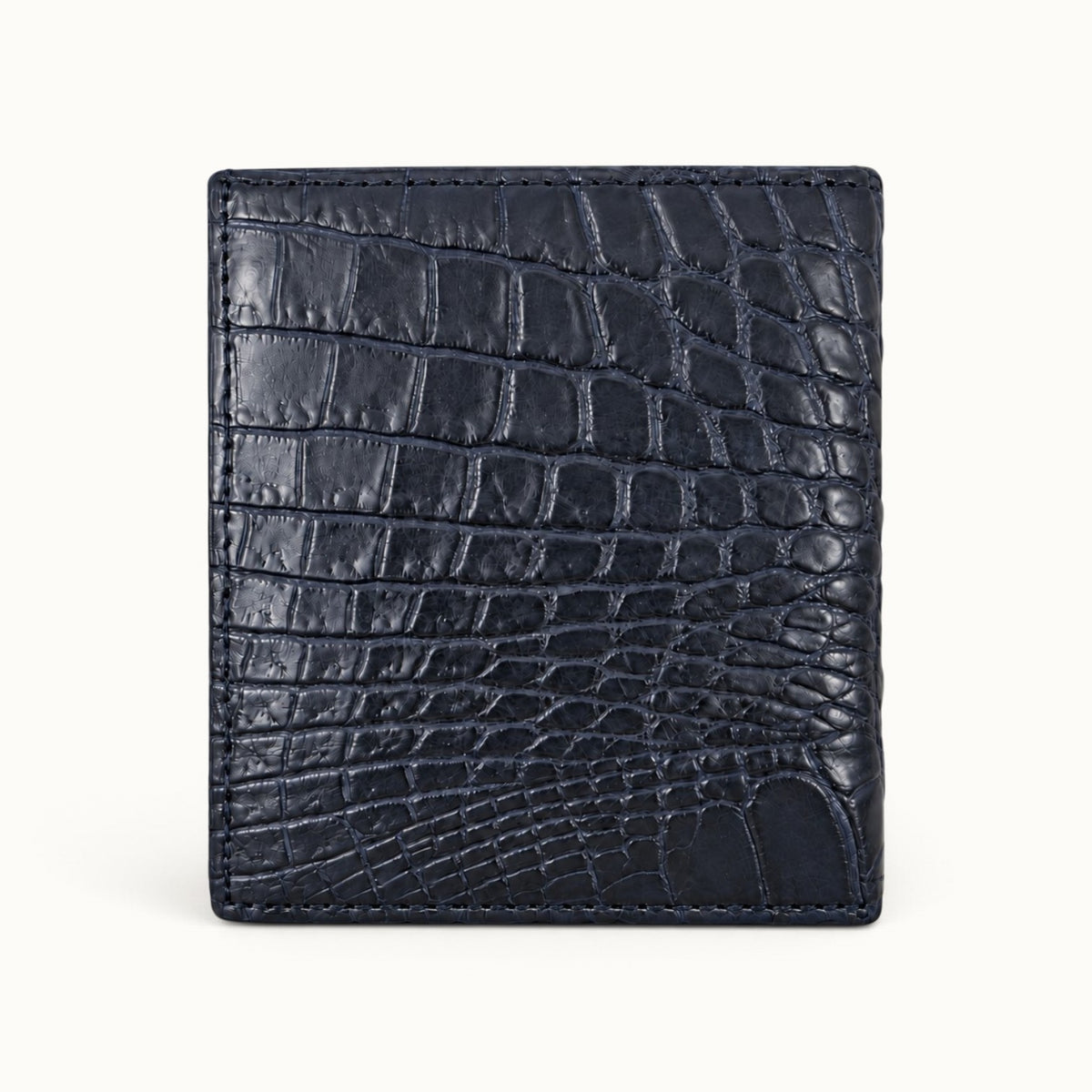 The Compact Crocodile Wallet in Deep Navy showing the natural Siamese crocodile scale pattern across the back exterior