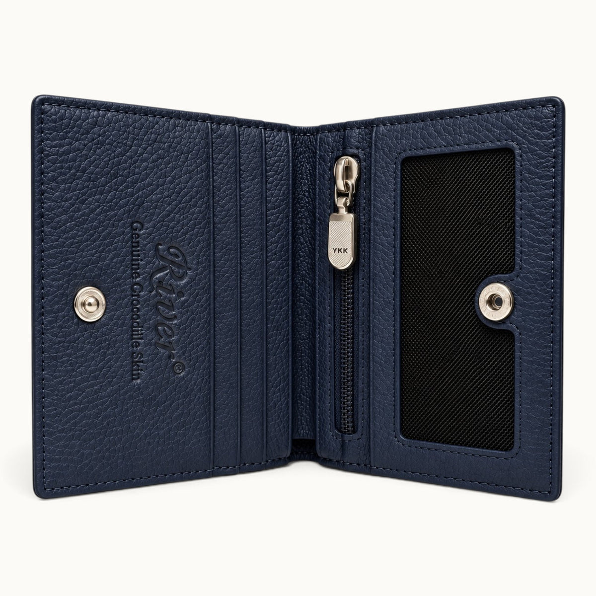 The Compact Crocodile Wallet in Deep Navy opened to show card slots, mesh ID window, YKK zip pocket and full-grain leather interior