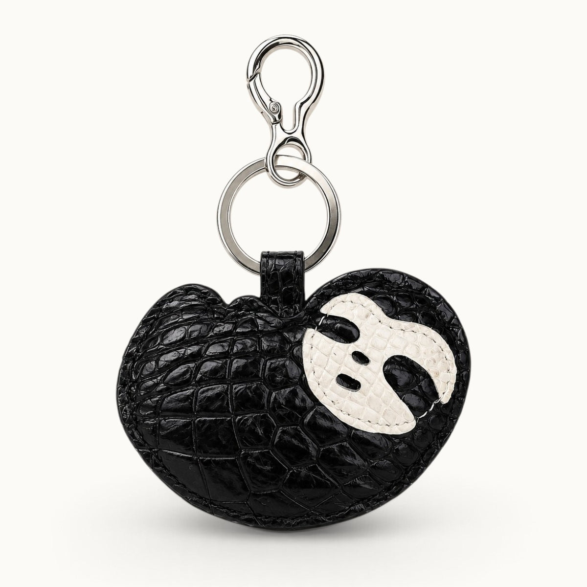 Jet Black Crocodile Palette Bag Charm back view showing natural crocodile scale texture and white mask motif