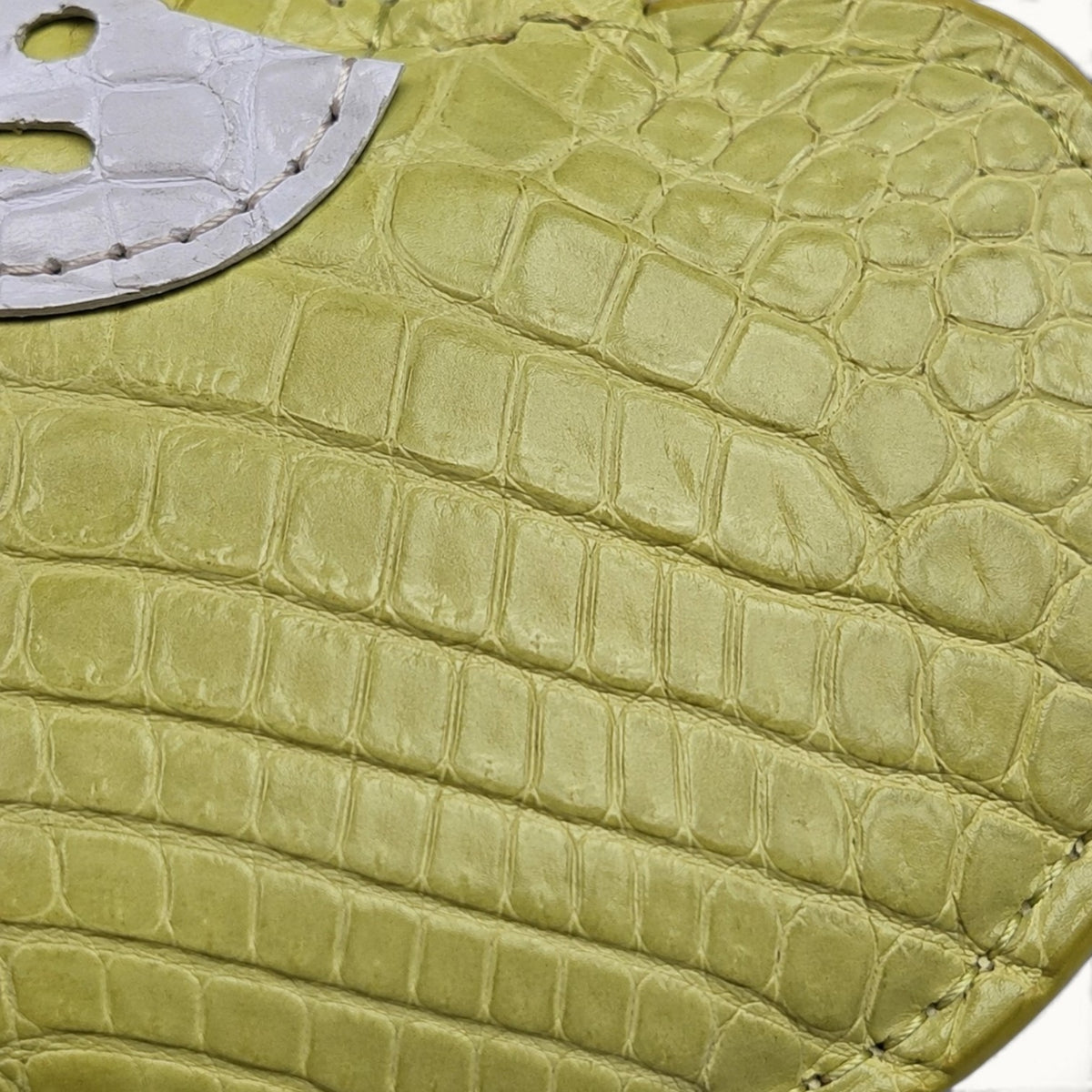 Close-up of Mustard Yellow Crocodile Palette Bag Charm showing natural crocodile scale texture and white mask detail