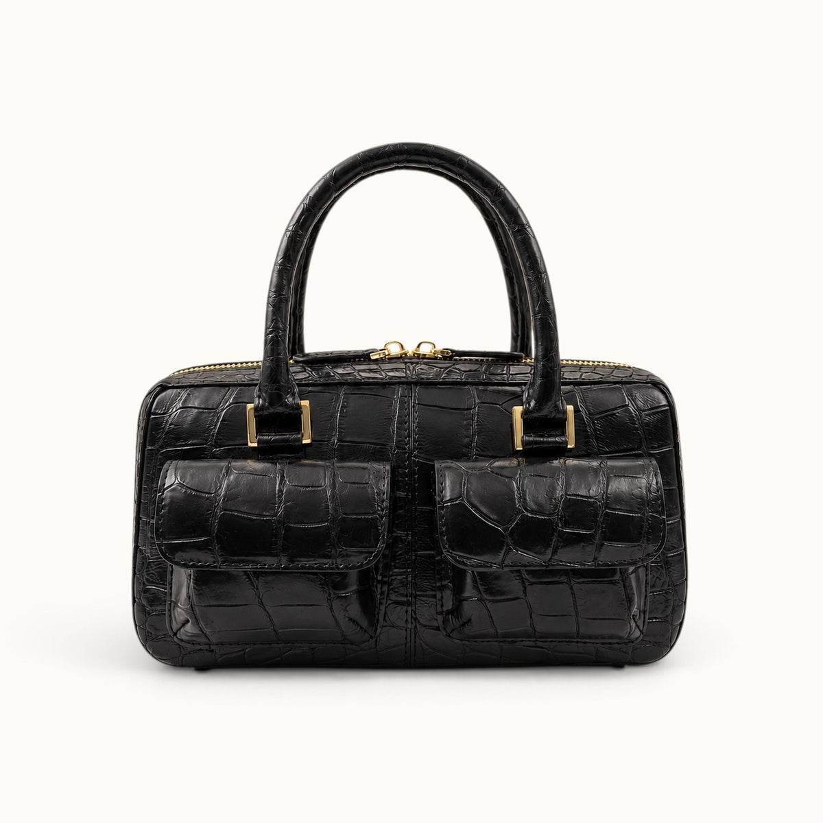Front hero view of the Fairmont Siamese crocodile handbag in Classic Black with two exterior flap pockets and gold-tone hardware.