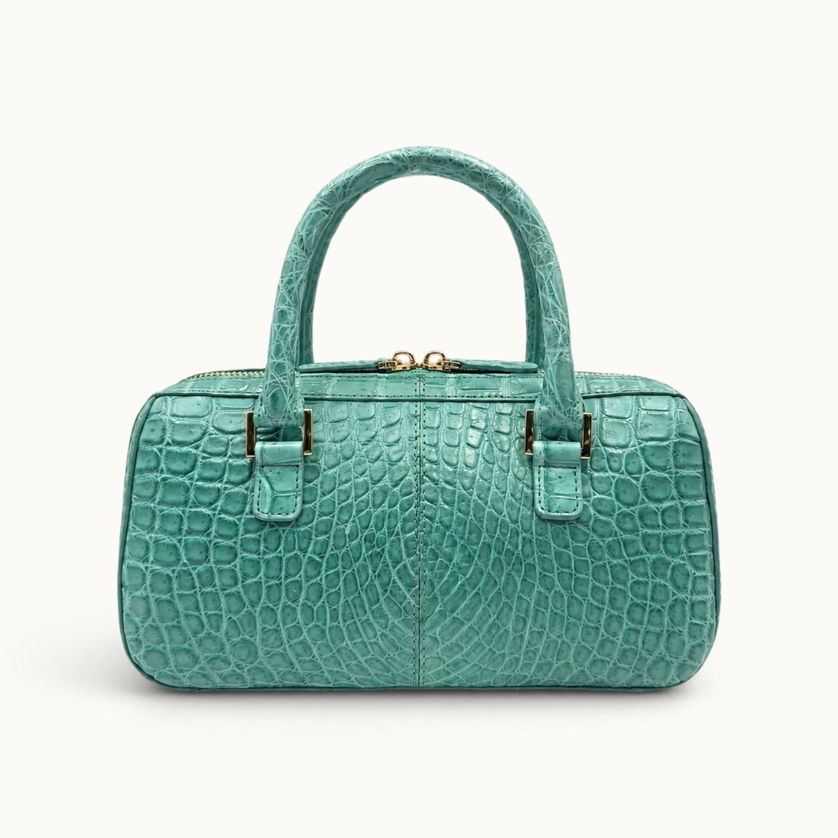 Back view of the Fairmont Seafoam Green Siamese crocodile handbag highlighting the natural scale pattern, center seam, and gold-tone handle hardware.