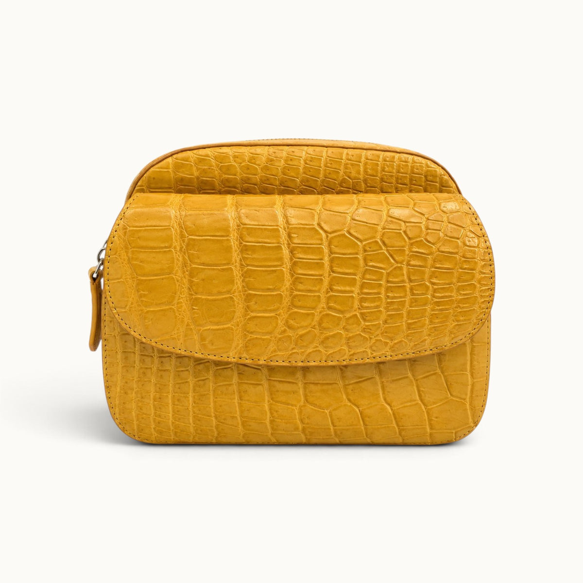 Front view of the Grosvenor Siamese crocodile crossbody bag in Golden Mustard.