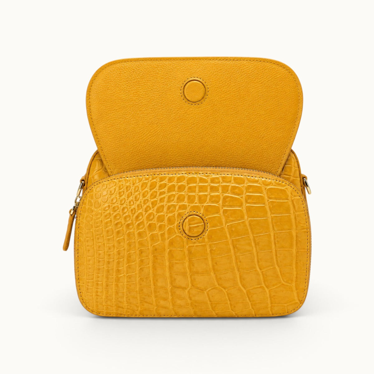 Grosvenor Siamese crocodile crossbody bag in Golden Mustard with the front flap open, showing the magnetic closure.