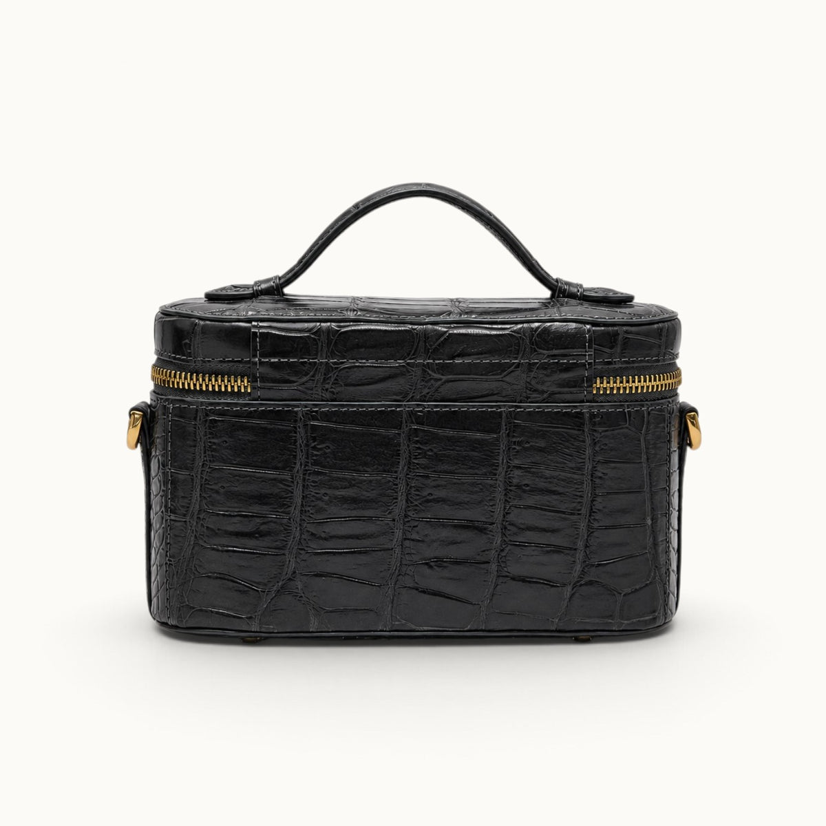 Back view of The Clarendon Gunmetal Gray Siamese crocodile mini handbag showing natural leather texture and structured construction.