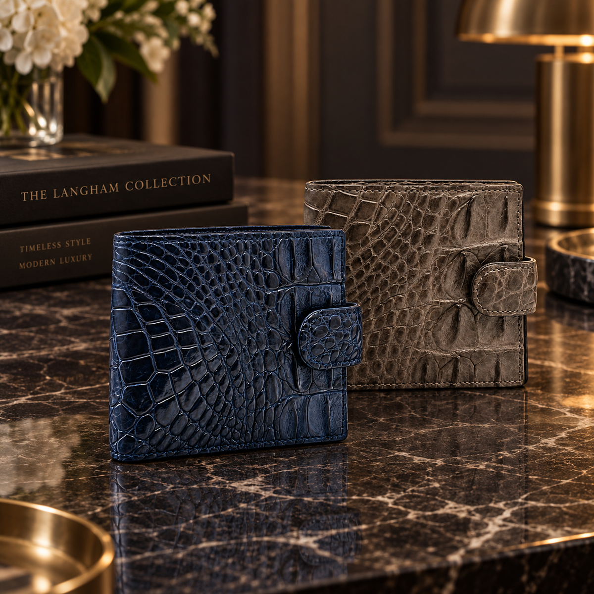 Langham crocodile wallets in deep navy and taupe green displayed together on a luxury marble surface