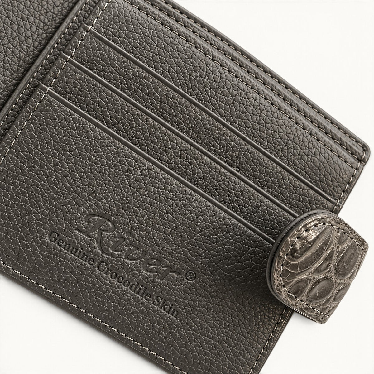 Taupe green Langham crocodile wallet interior detail with embossed River logo and snap closure