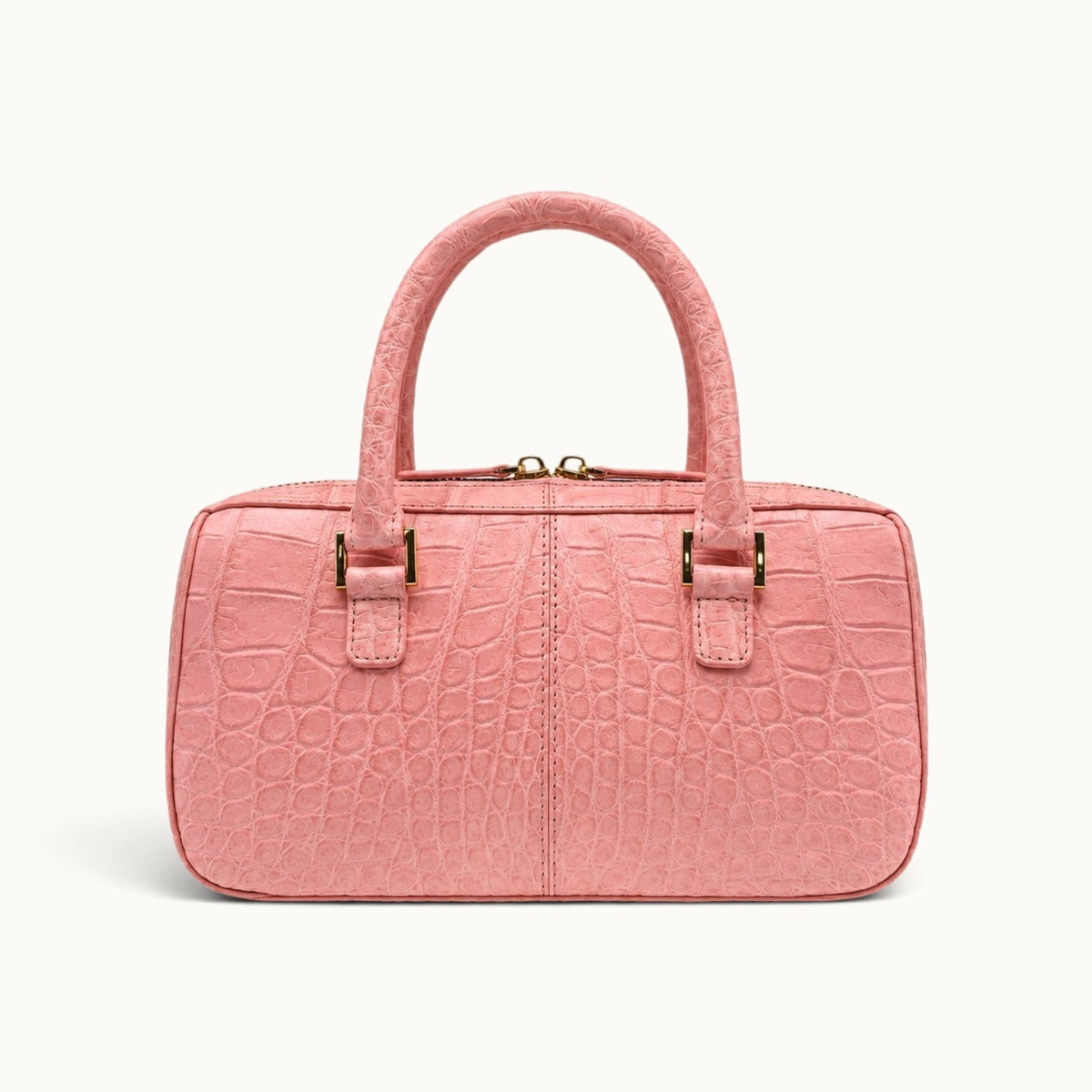back view of The Fairmont Crocodile Handbag in blush pink featuring natural crocodile scale pattern and elegant top handles.