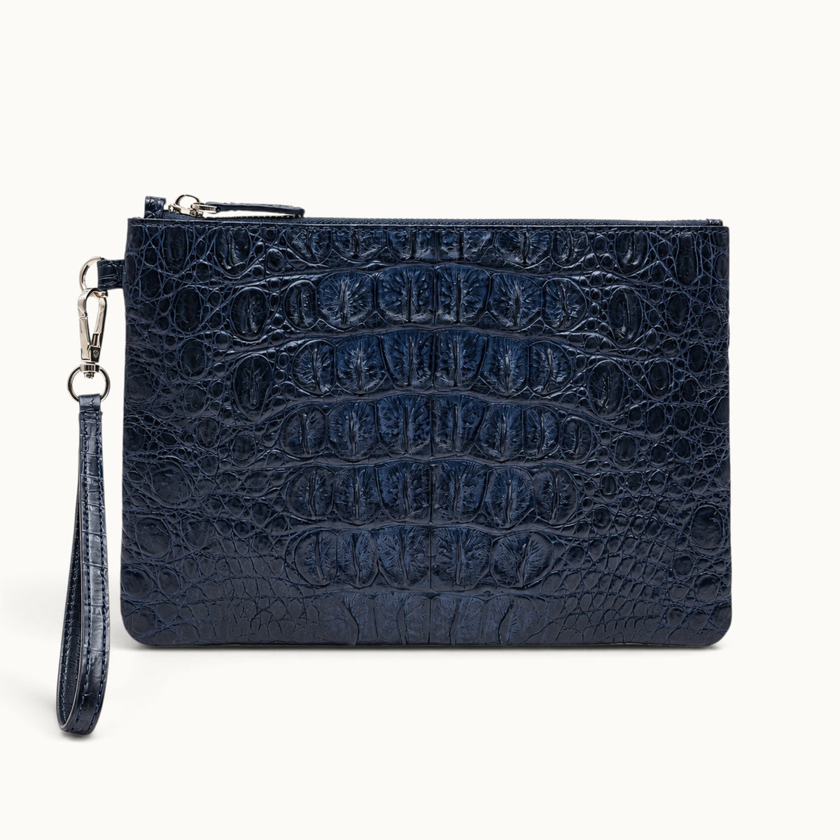 Deep navy crocodile wristlet bag with matching detachable strap and silver-tone hardware