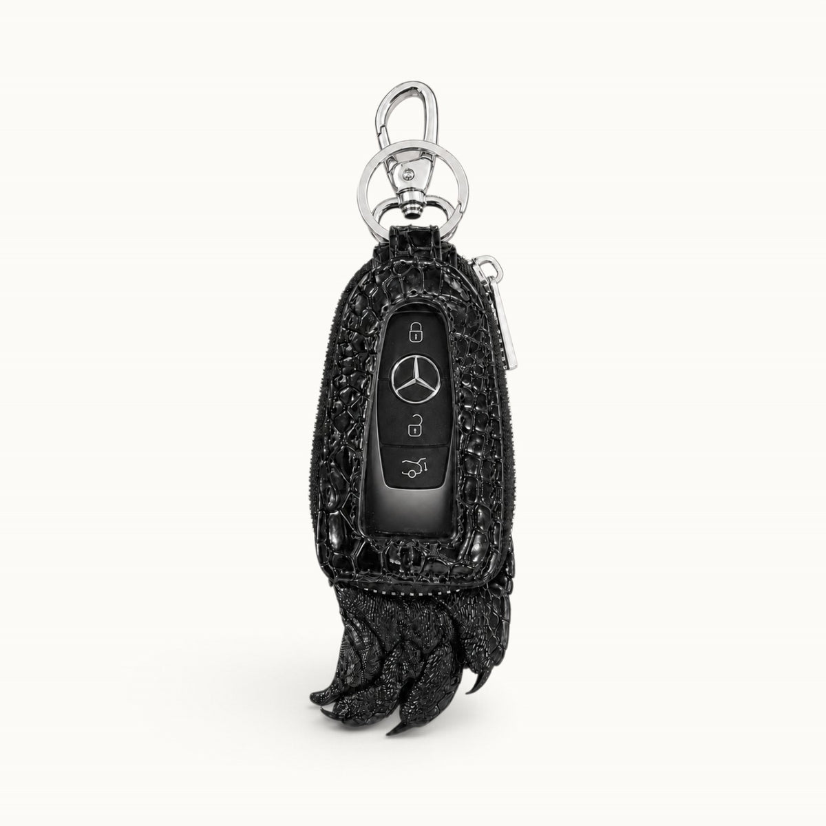 Black Siamensis crocodile leather car key case with a Mercedes remote displayed through the clear front window.