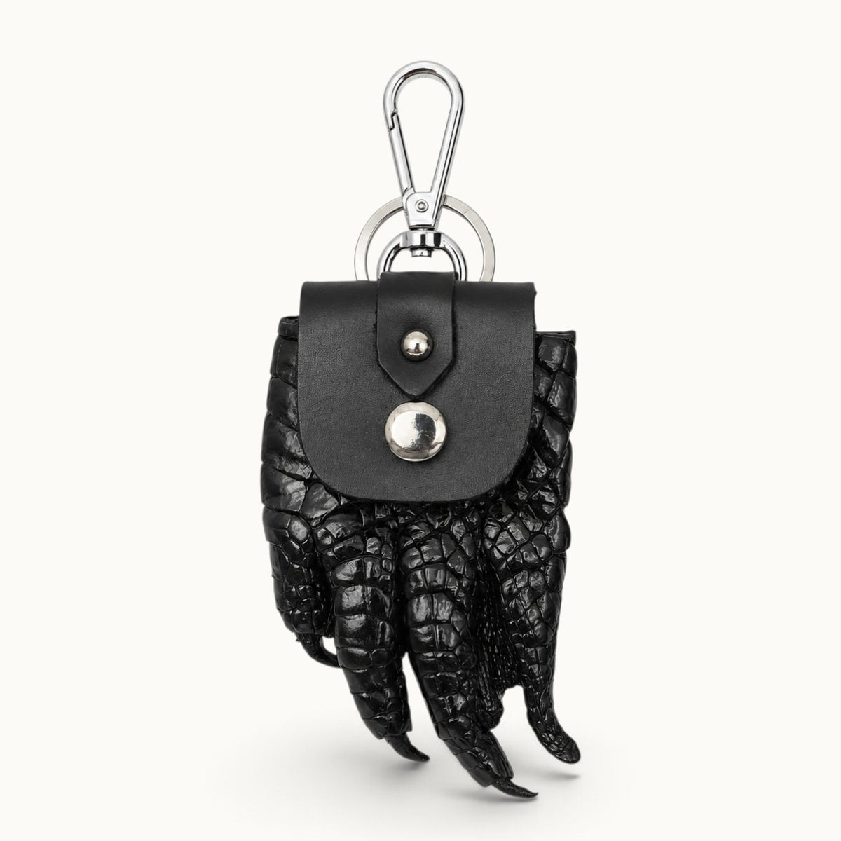 The Claw Crocodile Coin Pouch in black with silver clasp and key ring, front hero view