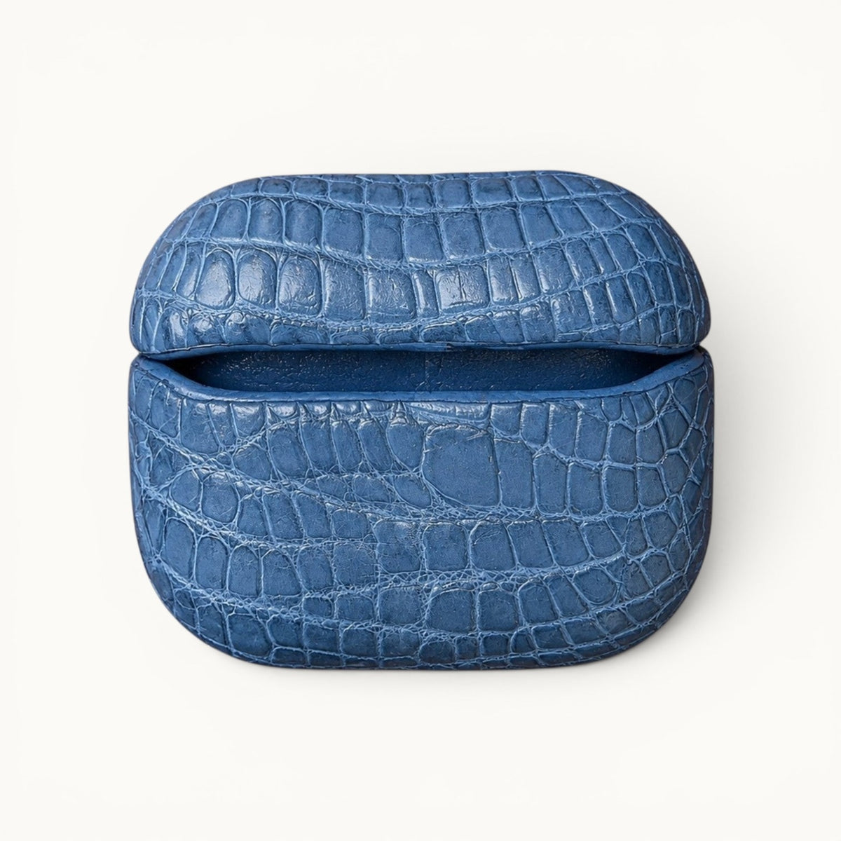 Back view of The Crocodile AirPods Case in French Blue made from genuine Siamese crocodile leather.
