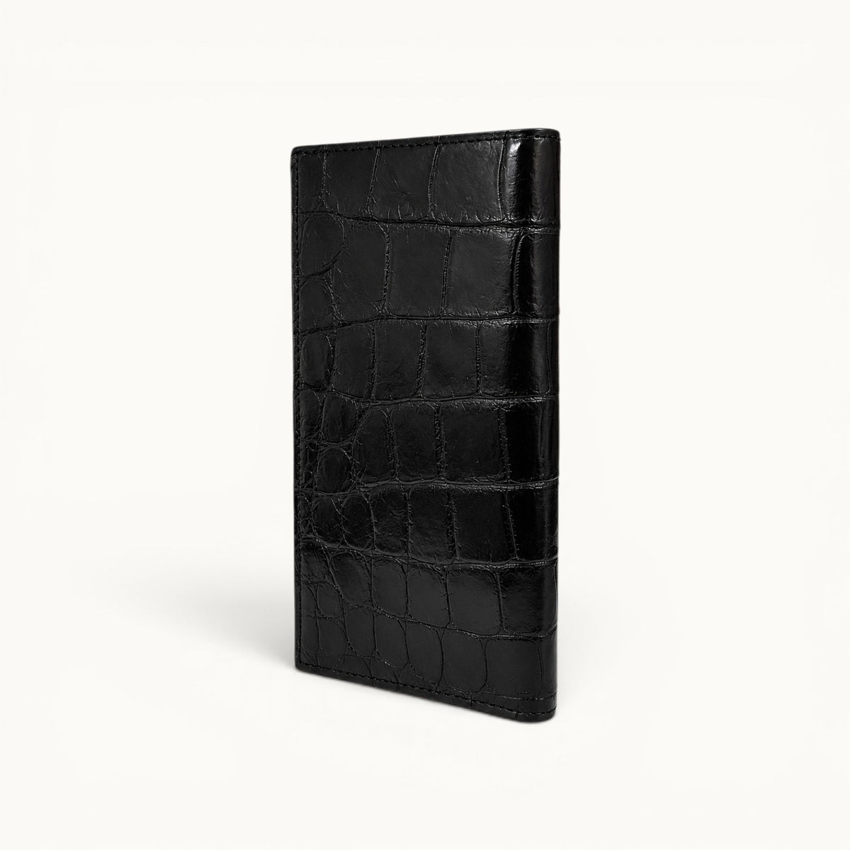 Rear angle view of The Kingsley Crocodile Long Wallet in Obsidian Black, handcrafted from genuine Siamese crocodile leather.