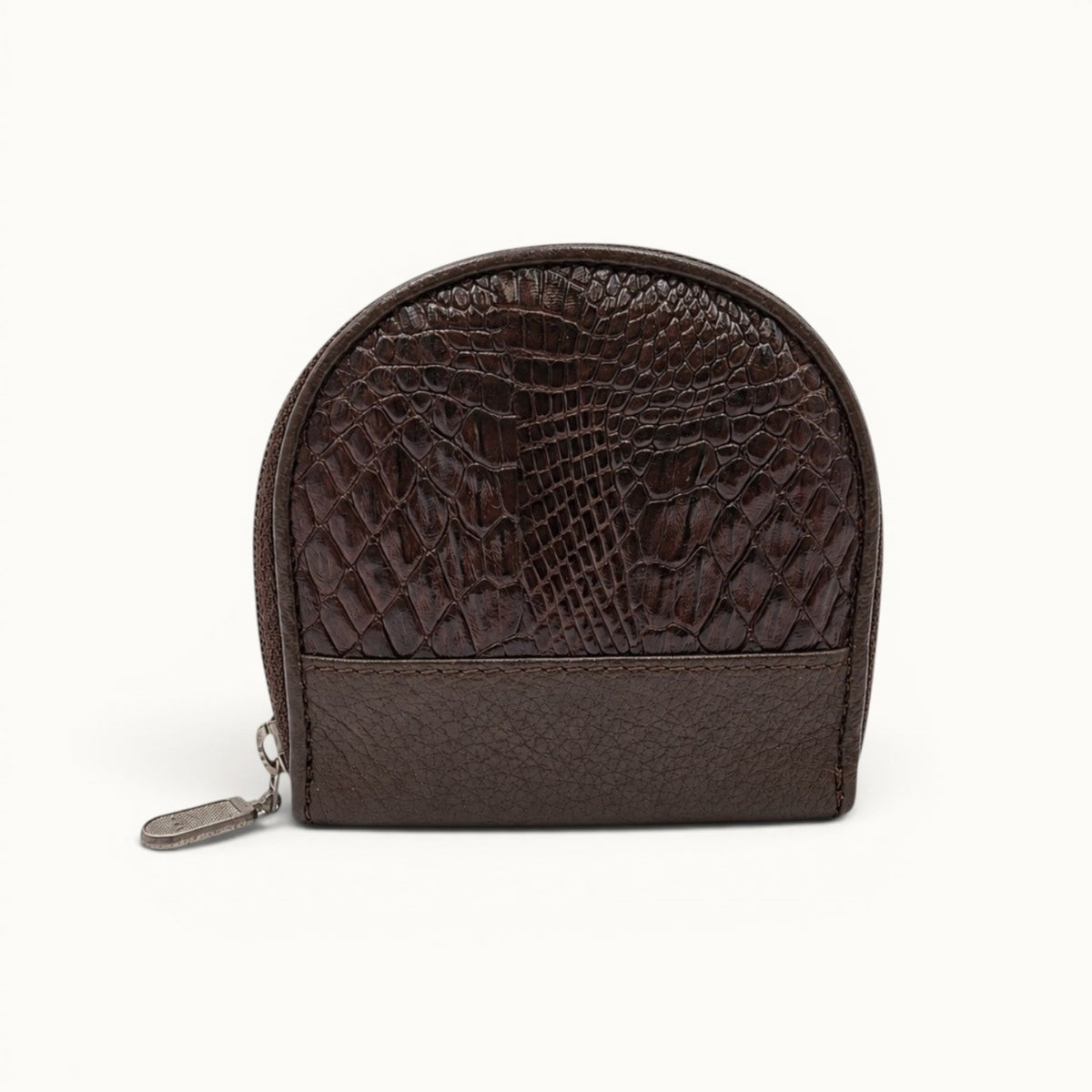 Front view of The Sovereign brown exotic leather zip coin wallet featuring a rich natural scale pattern, pebbled leather trim, and silver-tone hardware.