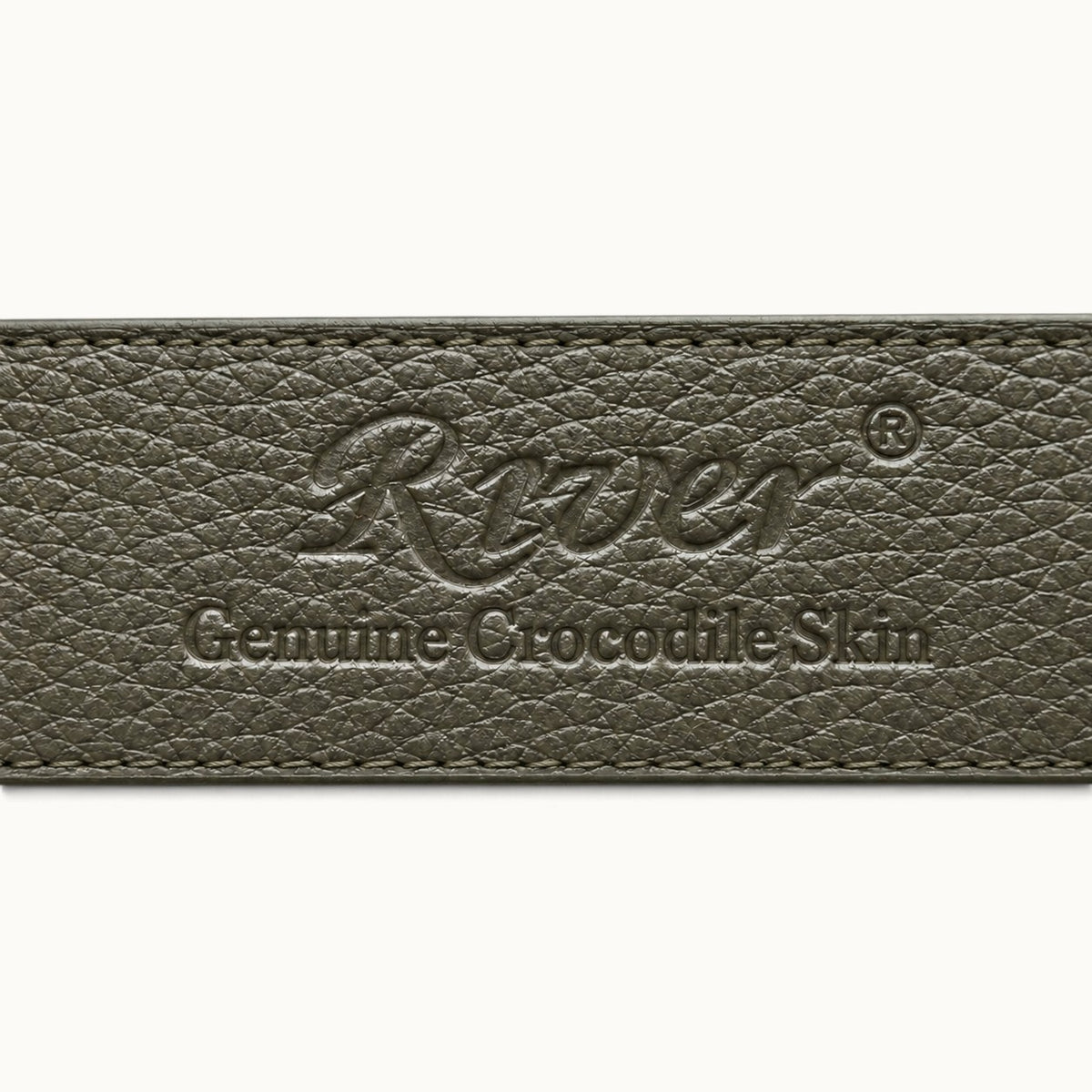 River logo and Genuine Crocodile Skin embossing on the Taupe Green leather interior of The Waverly Belt, with tonal edge stitching.