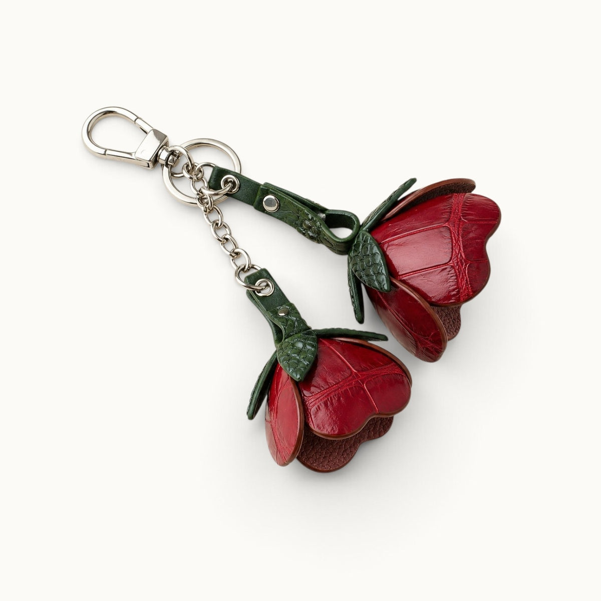 Three-quarter view of the Bordeaux Red Valencia crocodile flower charm showing petal depth and construction