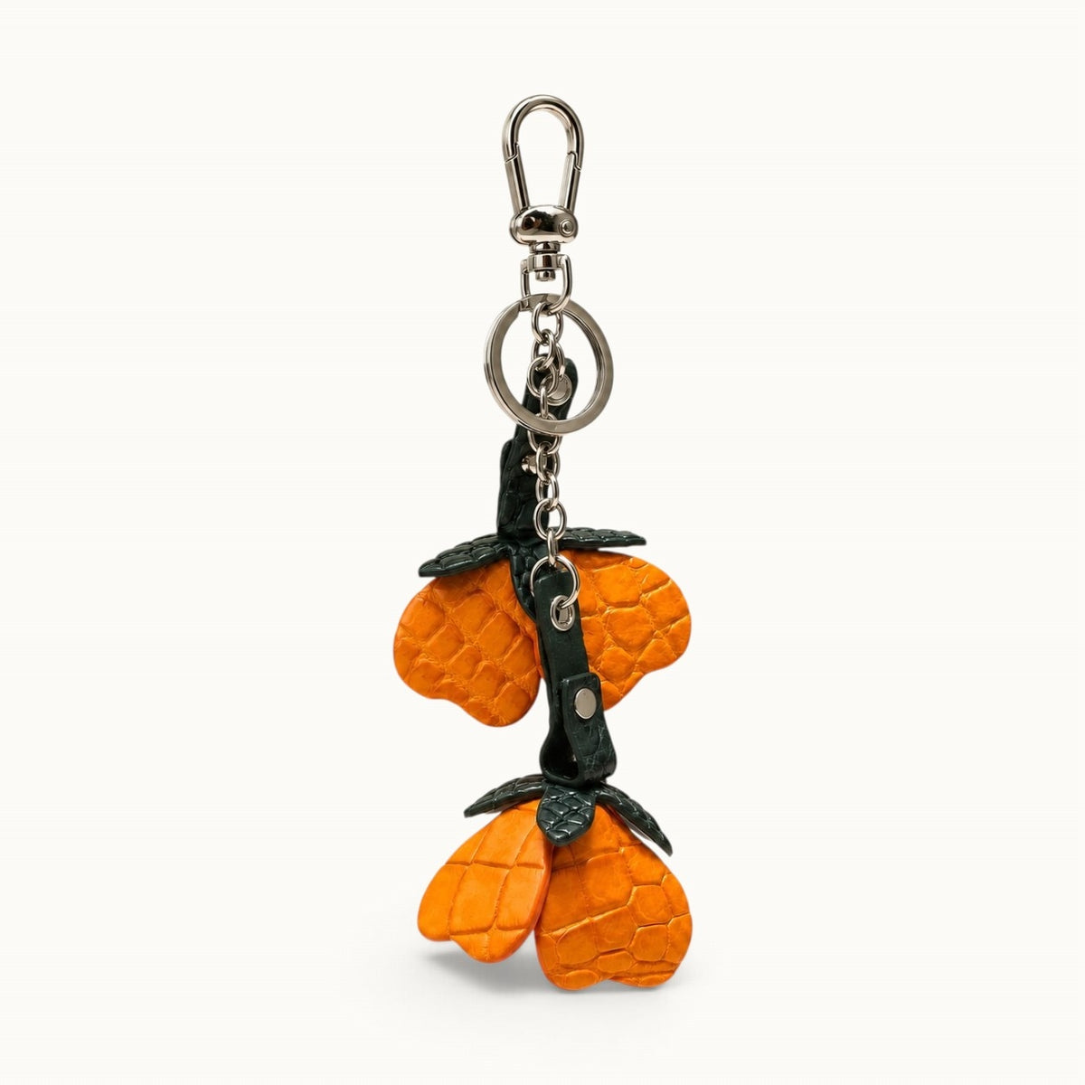 Burnt Orange Valencia crocodile flower charm with dark green leaves and polished silver-tone hardware