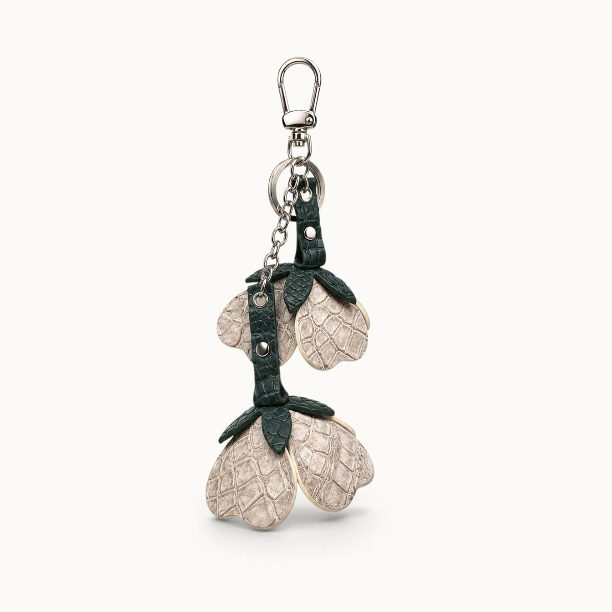 Stone Ivory Valencia crocodile flower charm with dark green crocodile leather leaves and polished silver-tone hardware