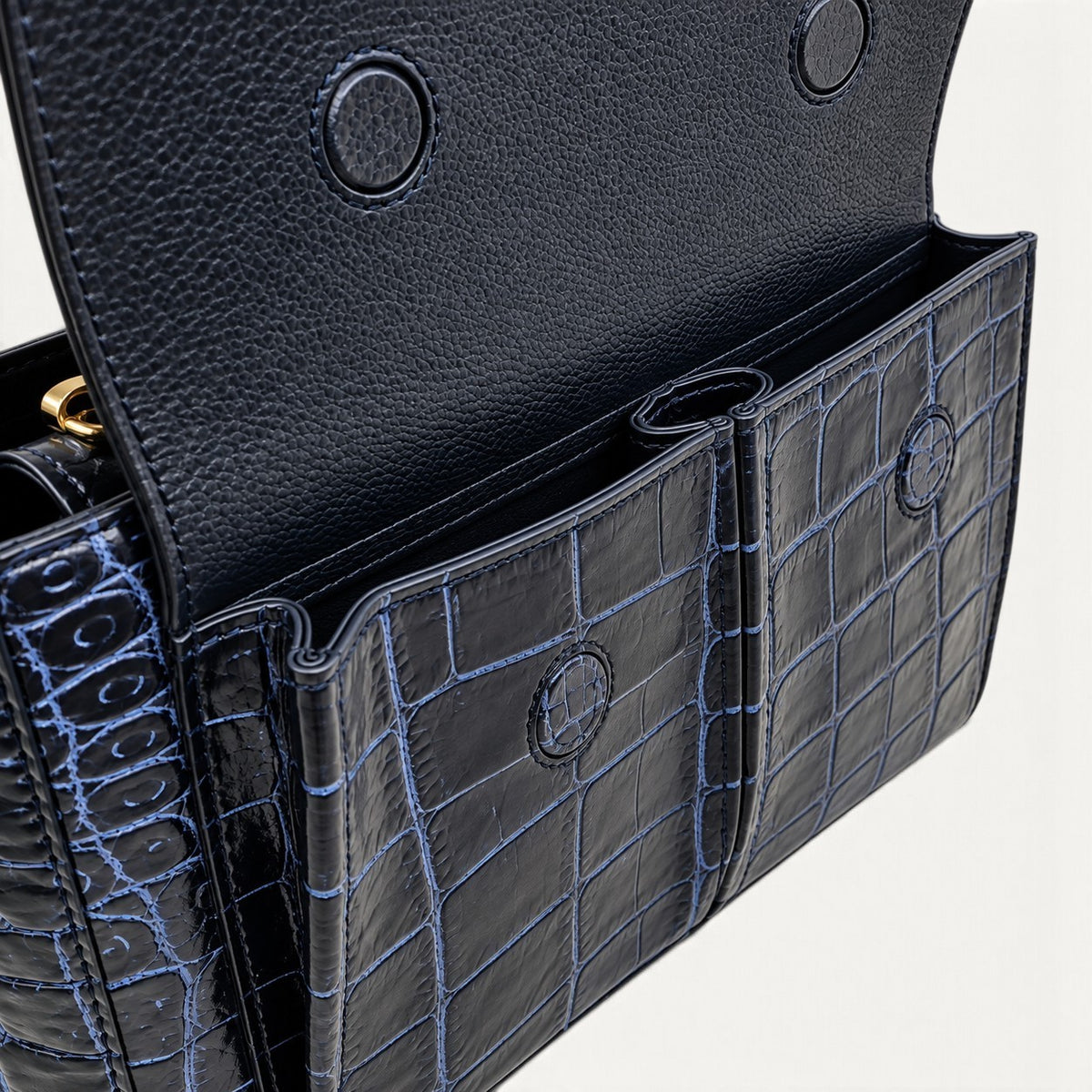Close-up of The Alderley Crocodile Shoulder Bag showing two front pockets beneath the flap with magnetic closures