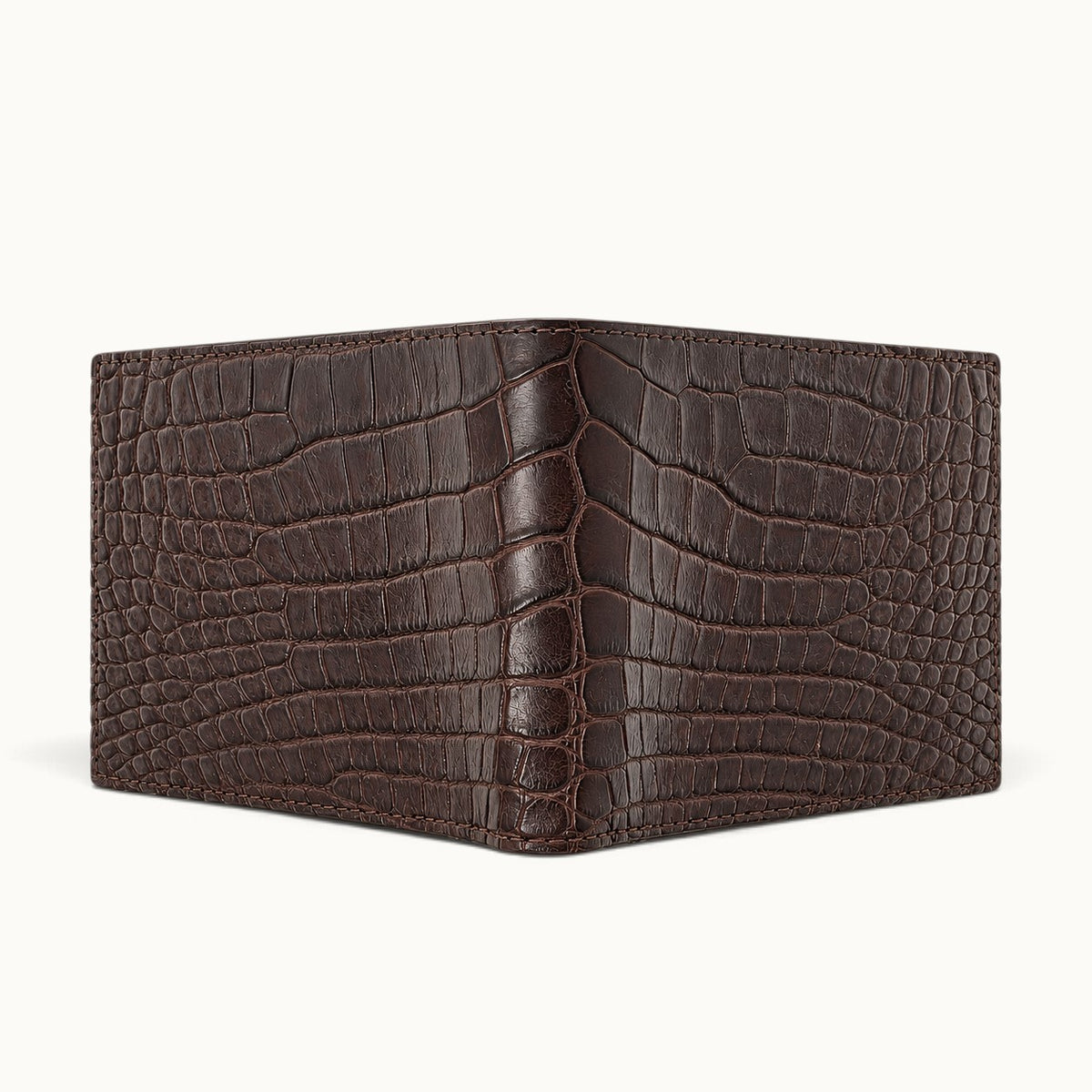 The Ashford brown crocodile bifold wallet fully opened to display the continuous genuine Siamese crocodile scale pattern across both exterior panels and central fold.