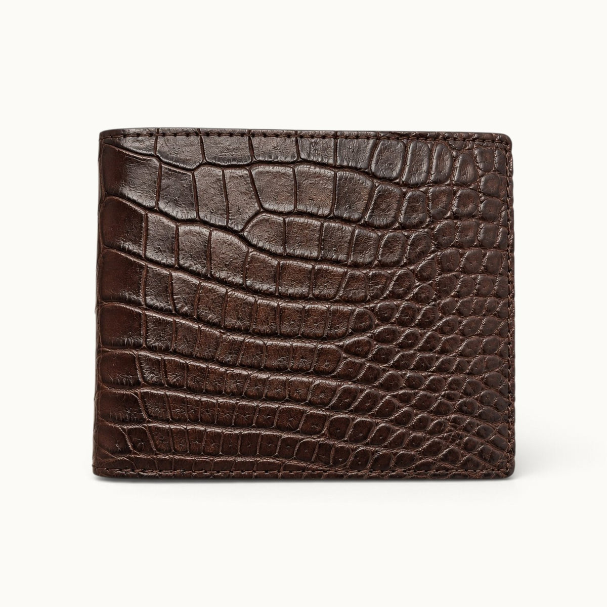 Front view of The Ashford luxury brown Siamese crocodile bifold wallet, showcasing its distinctive natural scale pattern, rich chocolate-brown color, and handcrafted finish.