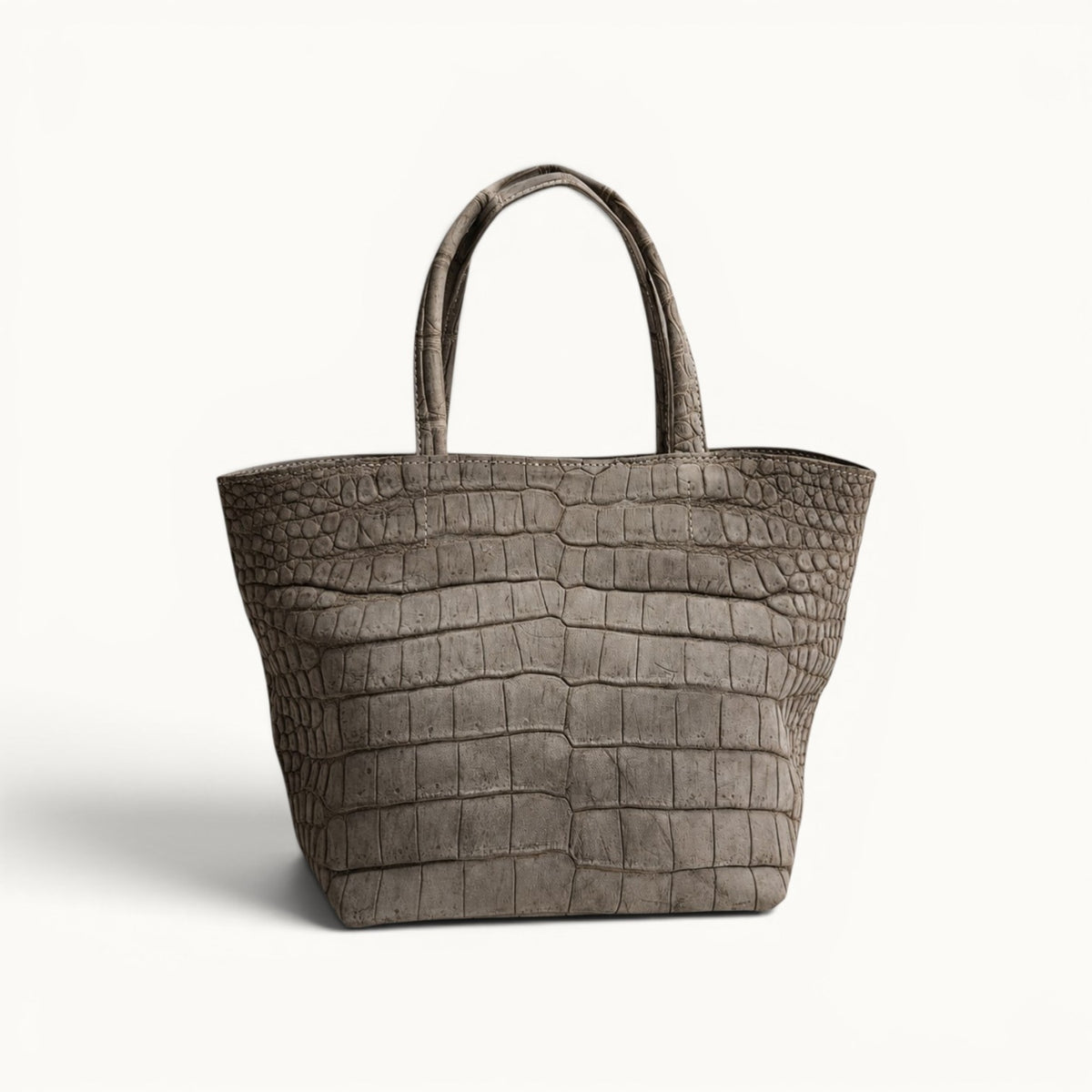 The Atelier Tote luxury Porosus crocodile leather tote bag, handcrafted from genuine Porosus crocodile leather with a lightweight construction and distinctive natural scale pattern.