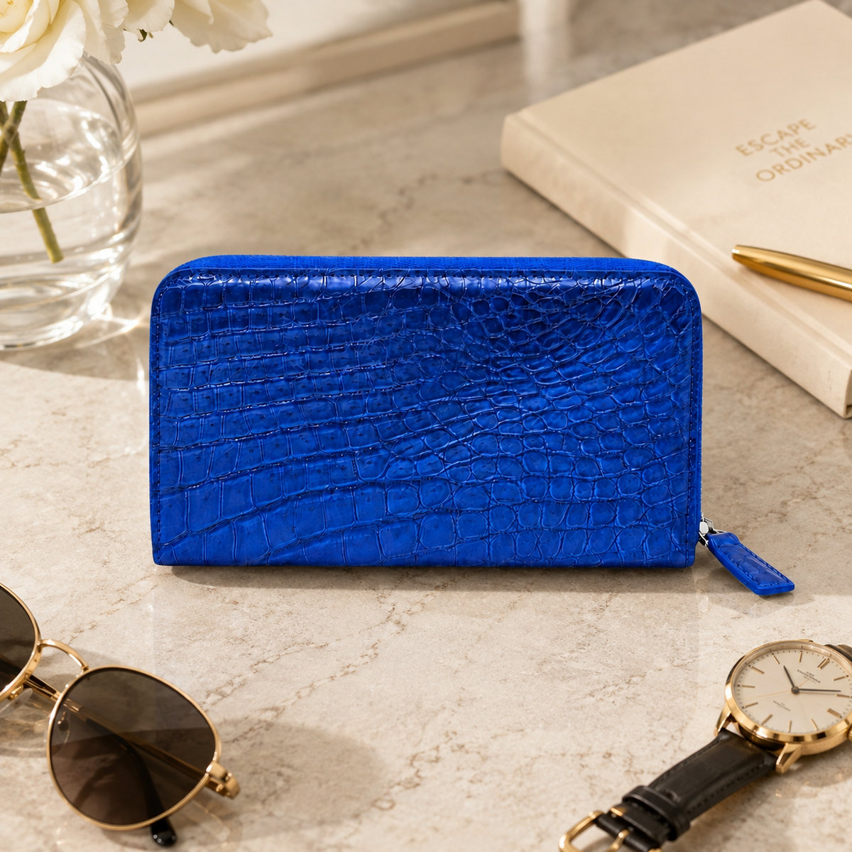 Belvedere royal blue crocodile zip wallet in a luxury square lifestyle setting with refined accessories.