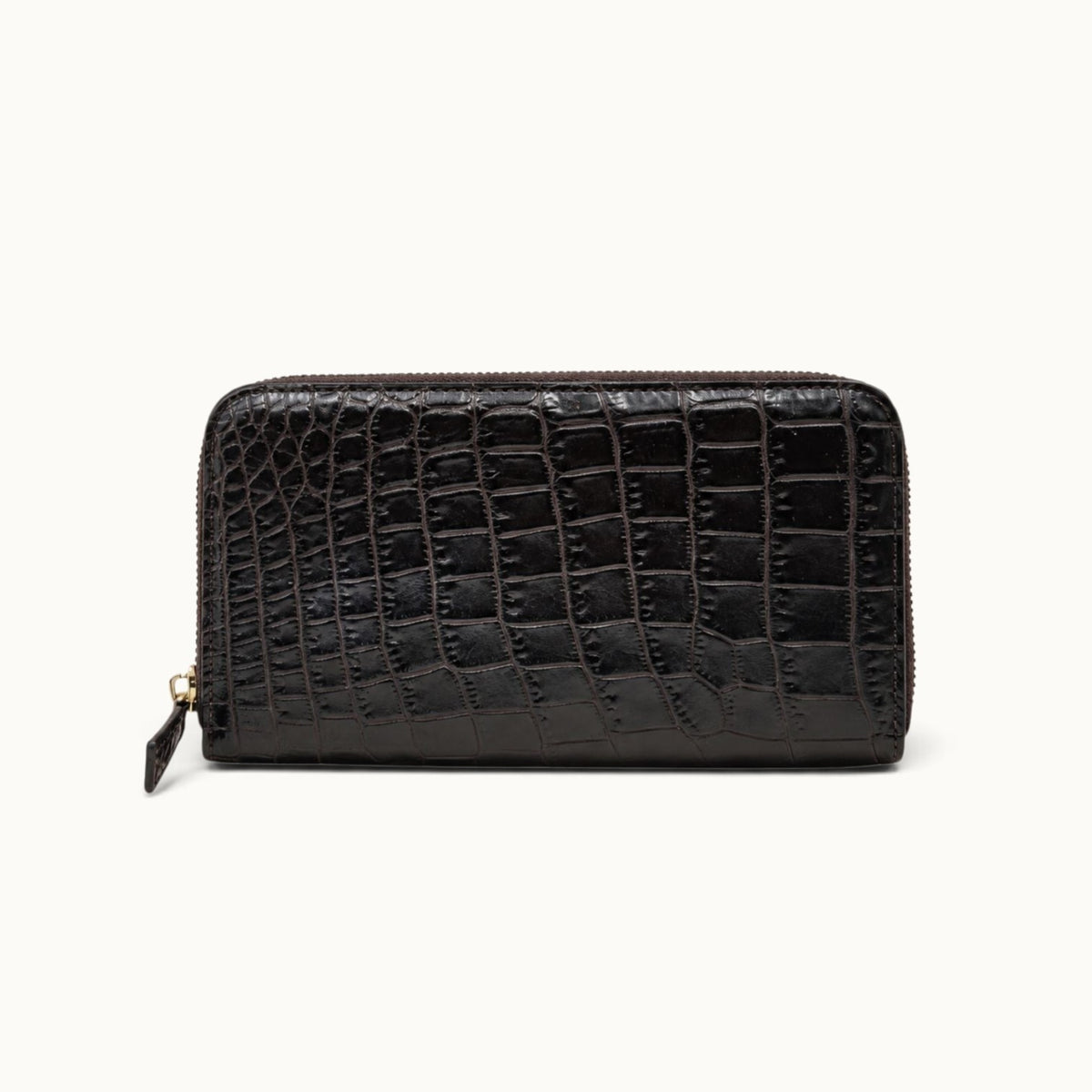 Front view of the Belvedere Siamese crocodile zip-around wallet in Nicotine Brown with gold-tone hardware