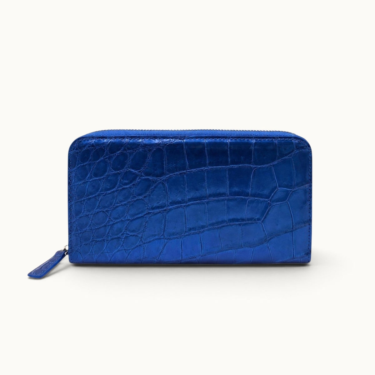 Front view of the Belvedere Siamese crocodile zip-around wallet in Royal Blue with gold-tone hardware
