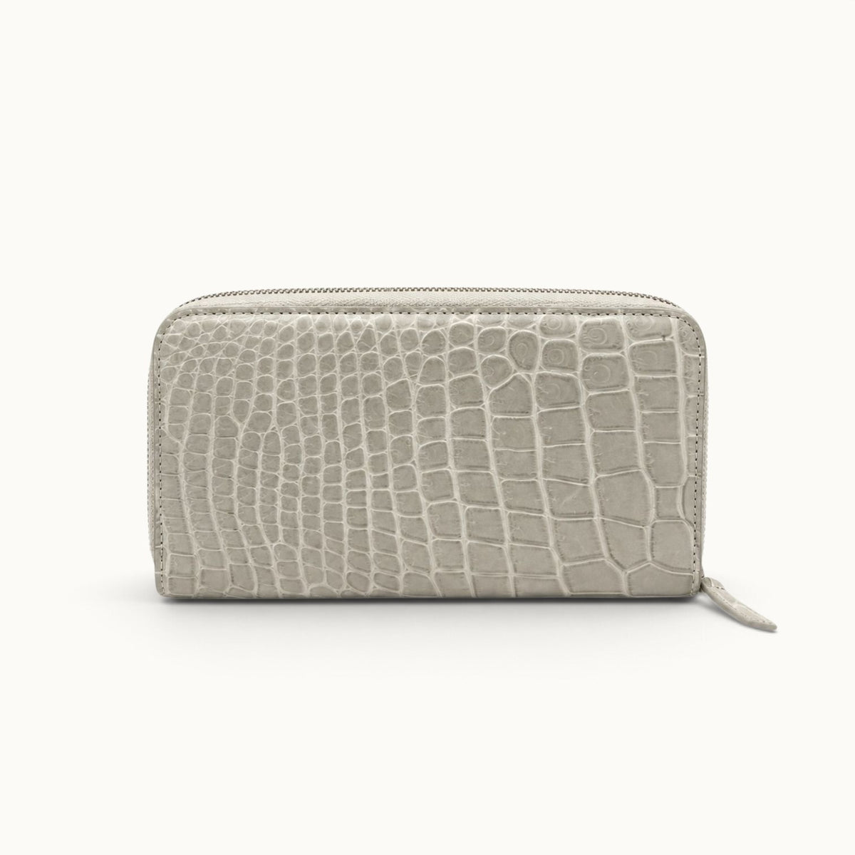 Front view of the Belvedere Siamese crocodile zip-around wallet in Stone Gray with gold-tone hardware
