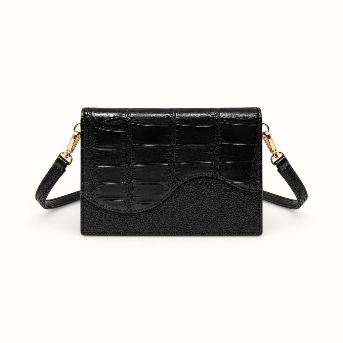 The Berkeley Crocodile Convertible Wallet in Black with a removable crocodile leather shoulder strap, genuine Siamese crocodile leather, and gold-tone hardware.