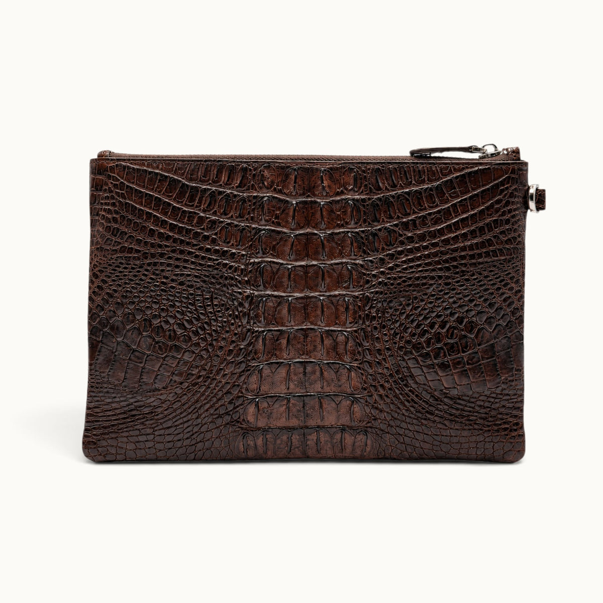 Back view of an espresso brown exotic skin clutch bag with distinctive crocodile scale pattern