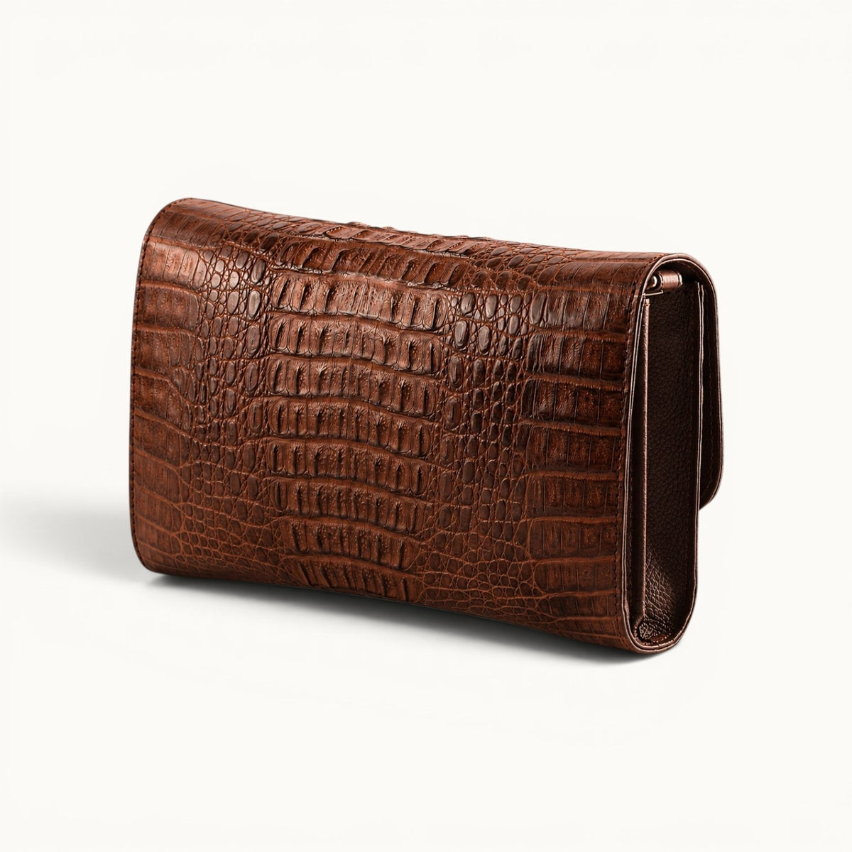 Back angle view of The Cavendish genuine caiman leather shoulder clutch bag in rich brown, showing the natural scale pattern and structured side profile.