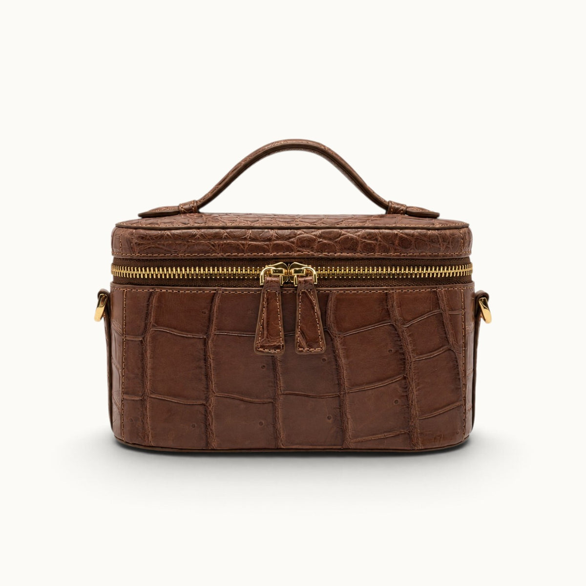 Front view of The Clarendon Cocoa Brown crocodile mini handbag with double zipper pulls and polished gold-tone hardware.