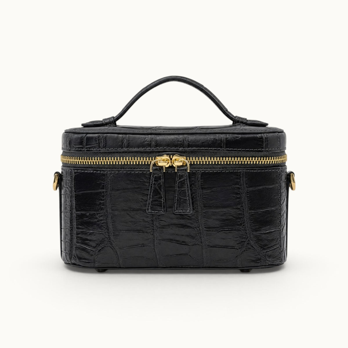 Front view of The Clarendon Gunmetal Gray genuine crocodile mini box bag with gold-tone hardware and double YKK zipper.