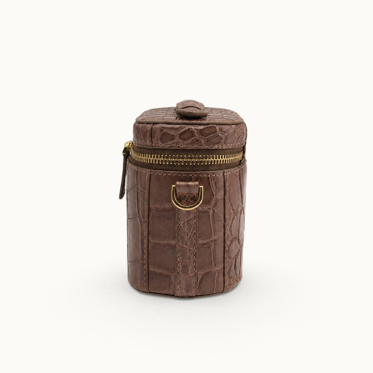 Side profile of a Cocoa Brown crocodile shoulder bag showing the compact structured body and removable strap attachment.