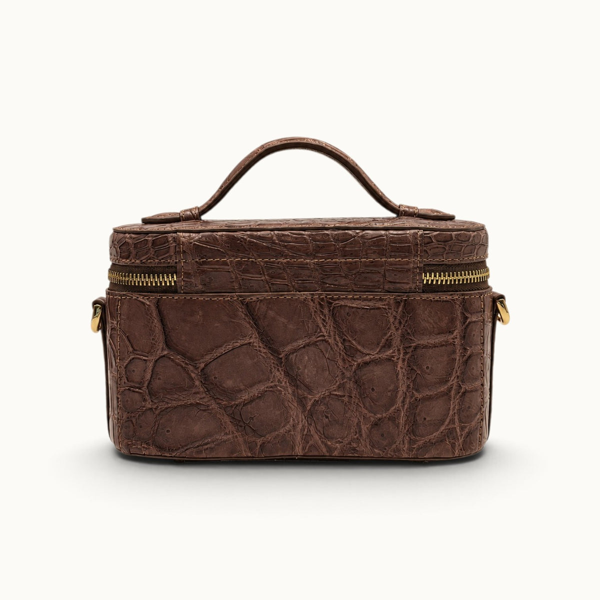 Back view of The Clarendon Cocoa Brown luxury crocodile vanity case bag with natural exotic leather scale variation.
