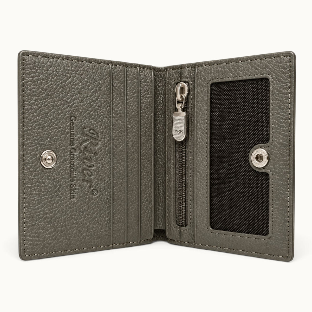 The Compact Crocodile Wallet in Taupe Green opened to show card slots, mesh ID window, YKK zip pocket and full-grain leather interior