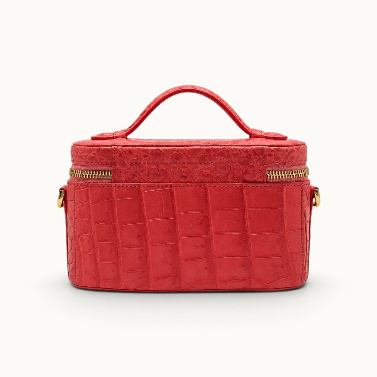 Back view of The Clarendon Coral Red Siamese crocodile evening handbag with handcrafted exotic leather construction.