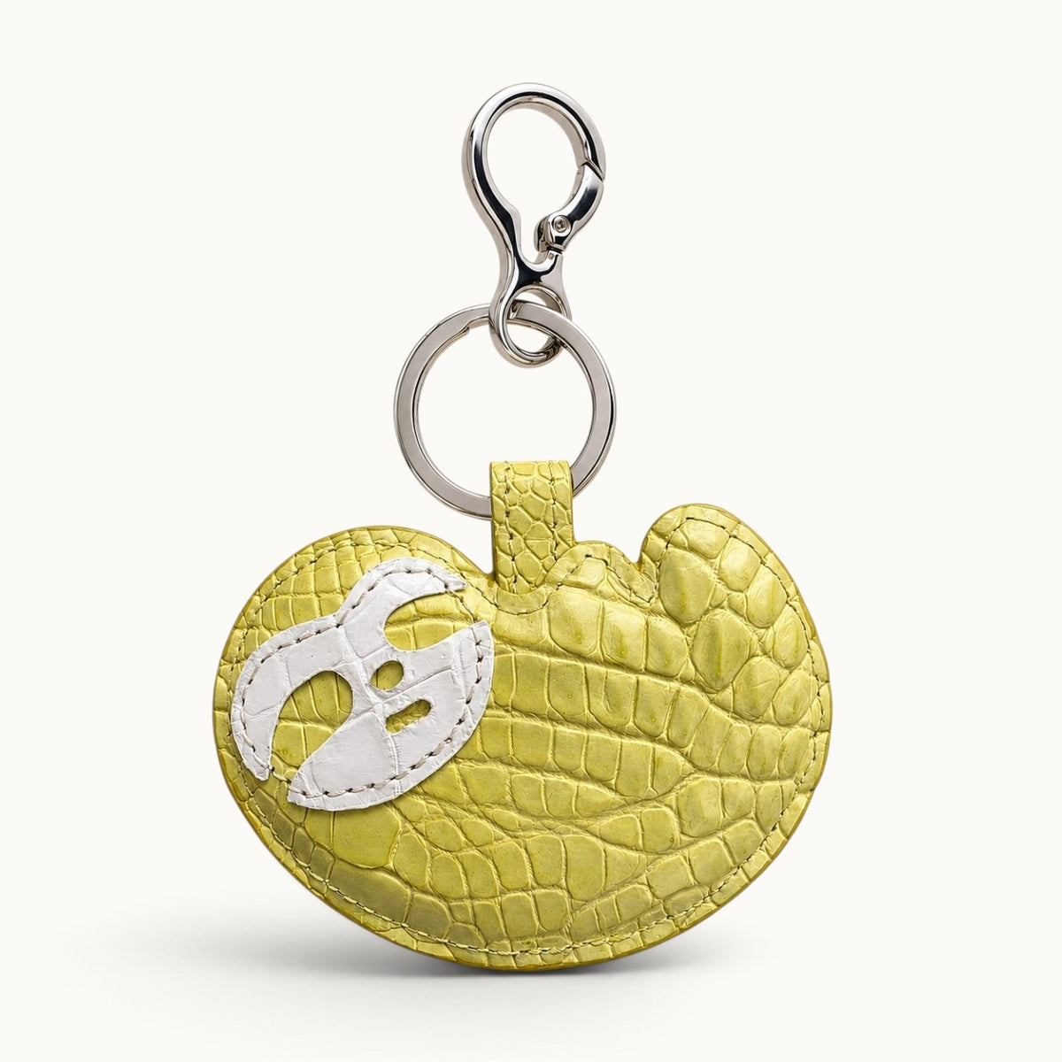 Mustard Yellow Crocodile Palette Bag Charm with white mask motif and polished silver-tone hardware