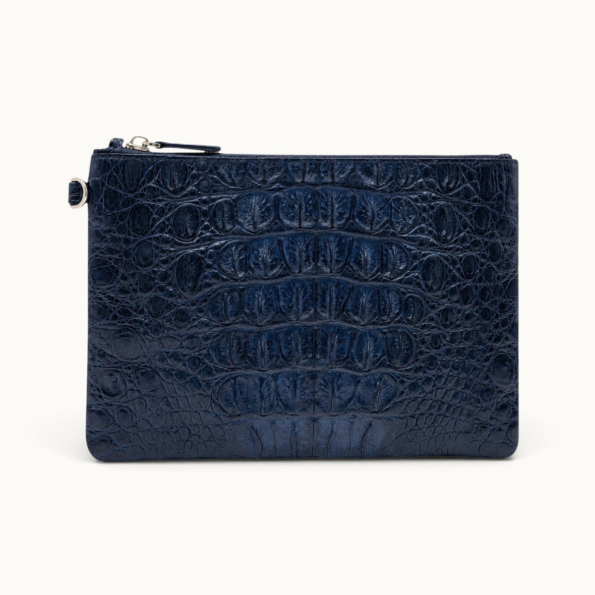 Deep navy crocodile leather clutch with rich natural scale texture and zip-top construction