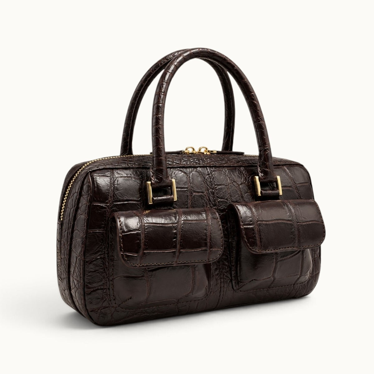 Espresso brown crocodile handbag angle front view with dual exterior pockets and gold-tone hardware