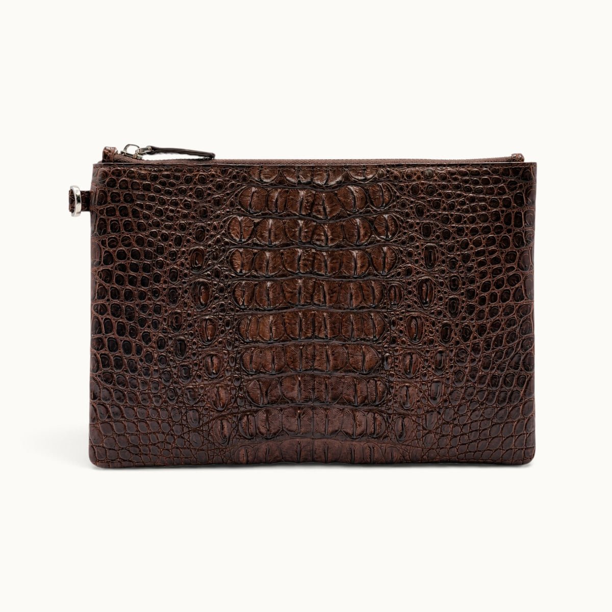 Espresso brown crocodile leather clutch featuring rich natural belly scale character