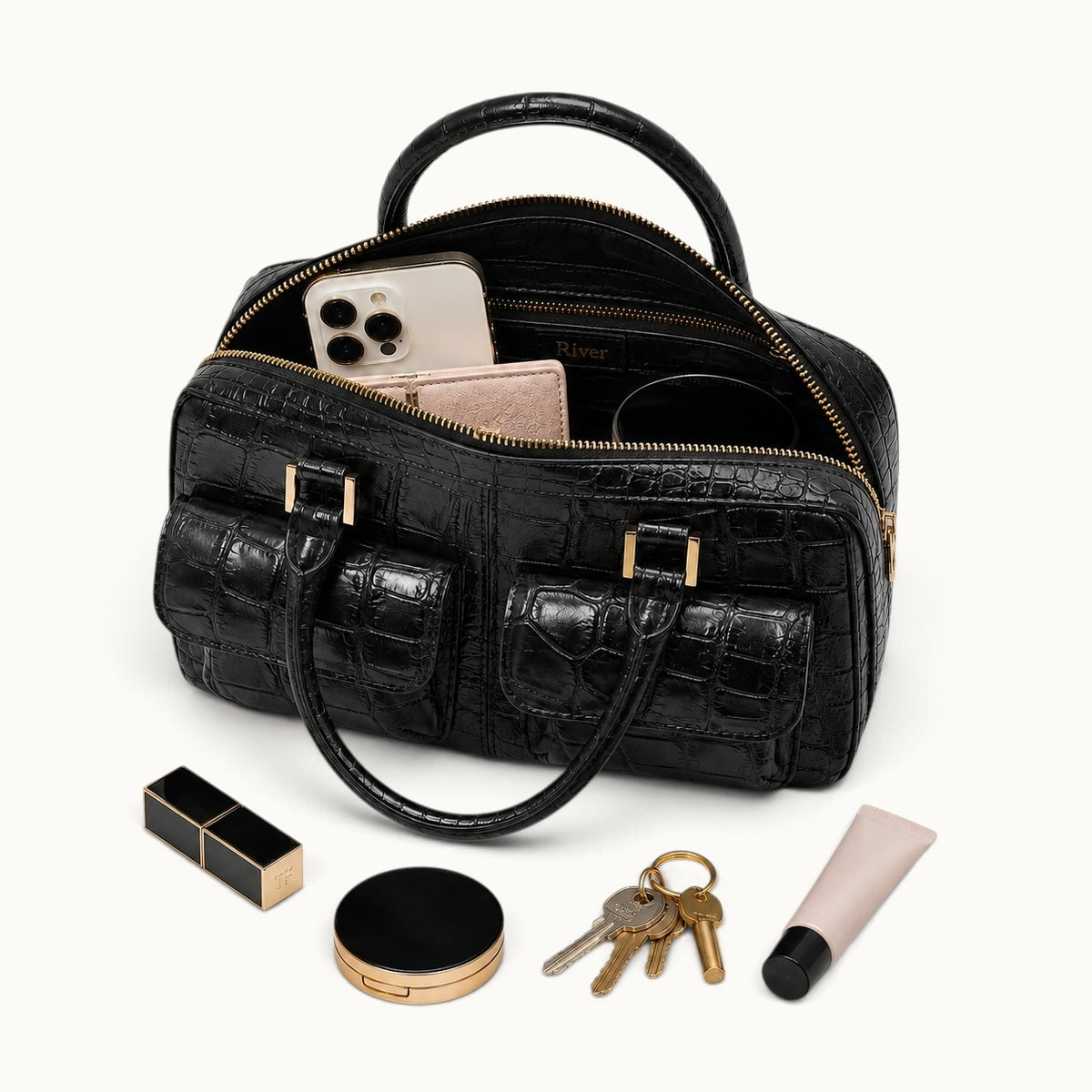 Fairmont Siamese crocodile handbag in Classic Black shown open with phone, wallet, sunglasses, keys, and everyday essentials.