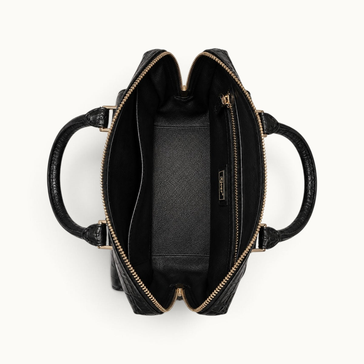 Open interior view of the Fairmont Classic Black crocodile handbag showing the full-grain leather lining, slip pocket, zip pocket, and River detail.